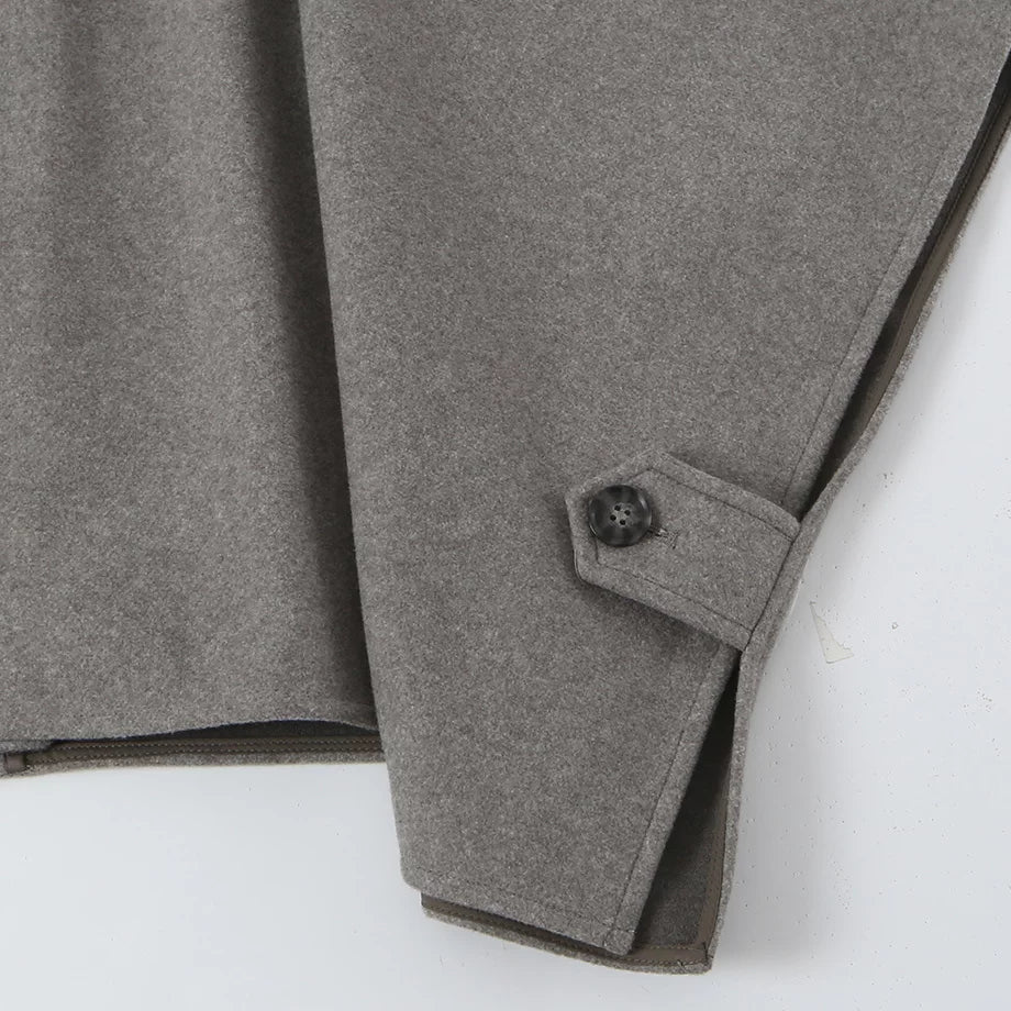 Button tab at the hem, close-up