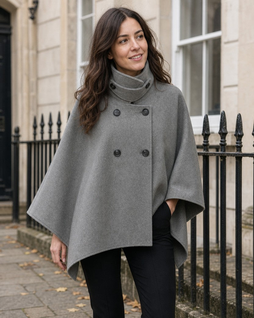 Grey double-breasted cape coat with funnel neck styled on a model (AI-generated image)