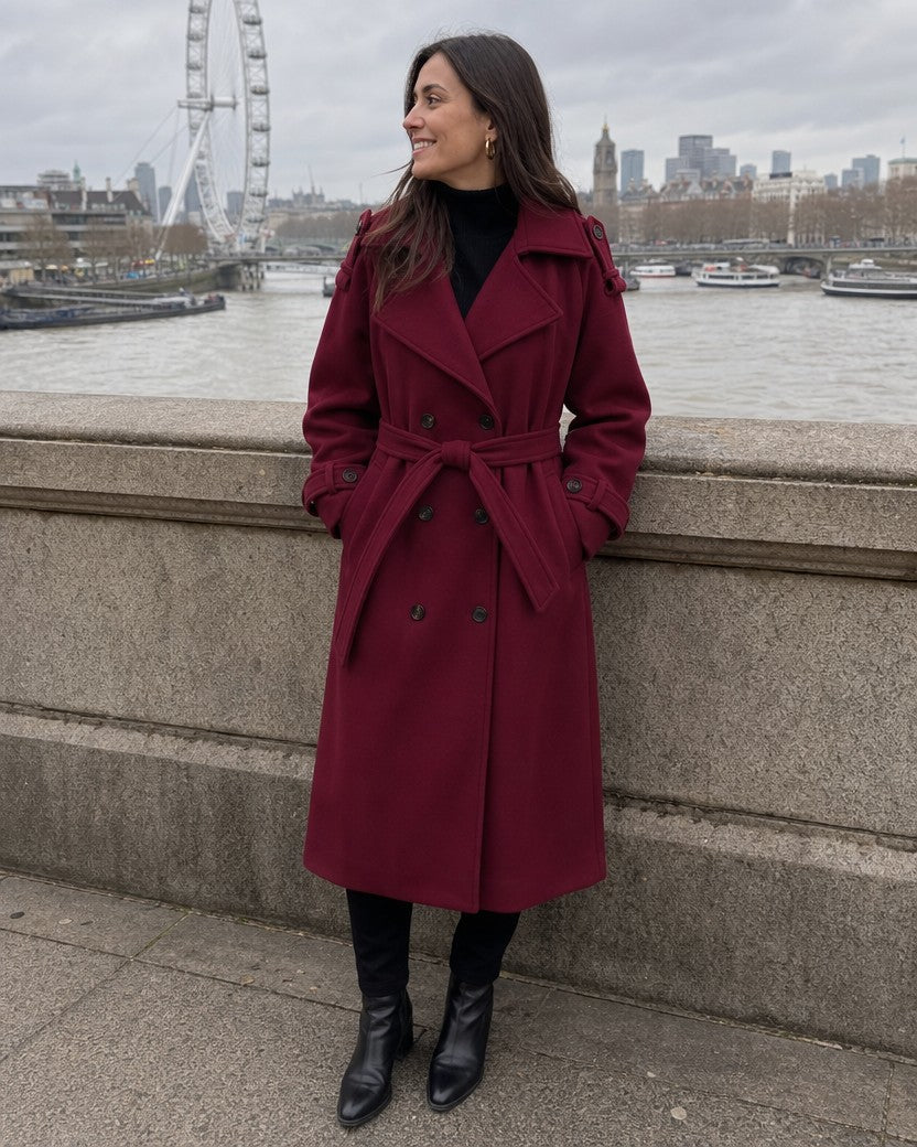 Burgundy long belted double-breasted coat styled on a model (AI-generated image)